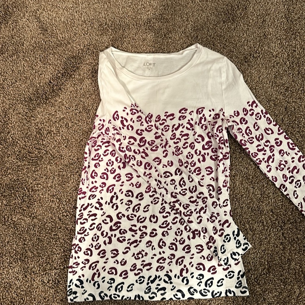 White long sleeve top with print on front, back and arms . Like new.